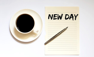NEW DAY - white paper with pen and coffee on wooden background