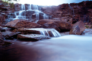 landscape photo of a waterfall taken in long exposure method 