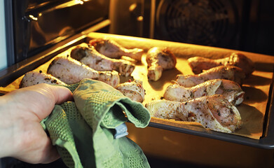 Baked chicken in the oven. Turkey legs on a baking sheet with spices baked in the oven. Snack on Thanksgiving Day.