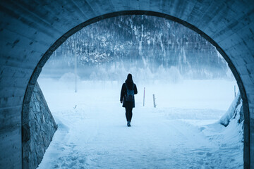 Woman walking in snow