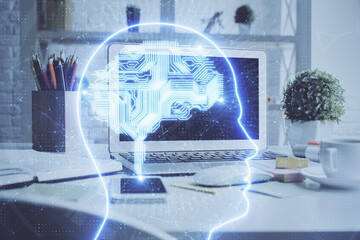 Double exposure of work space with computer and human brain drawing hologram. Brainstorm concept.