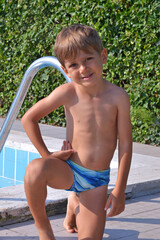 Little kid swimsuit at swimming pool