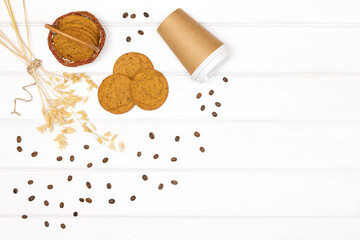 Naklejka na ściany i meble Oatmeal cookies with oat stems ears, coffee cup and coffee beans. Healthy takeaway coffee dessert