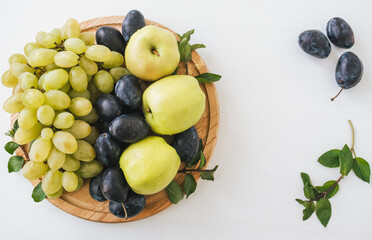 Top view of tasty fresh fruits on bright background.