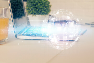 Computer on desktop with social network hologram. Multi exposure. Concept of international people connections.