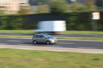Fototapeta na wymiar car panning on highway.
