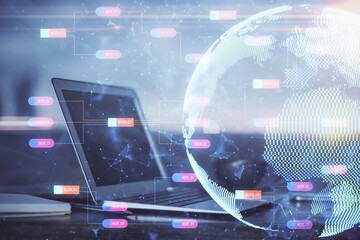 Obraz premium Multi exposure of table with computer and world map hologram. International data network concept.