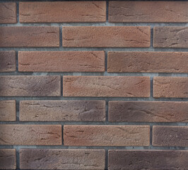 Obraz premium texture of rough brick shimmering in different shades with decorative cracks
