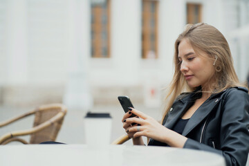businesswoman texting on mobile phone