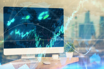 Financial chart drawing and table with computer on background. Multi exposure. Concept of international markets.