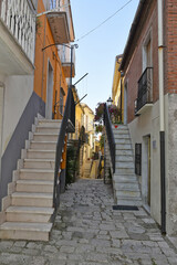 A narrow street among the old houses of San Bartolomeo in Galdo, a small town in the province of Benevento, Italy.
