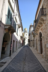 A narrow street among the old houses of San Bartolomeo in Galdo, a small town in the province of Benevento, Italy.
