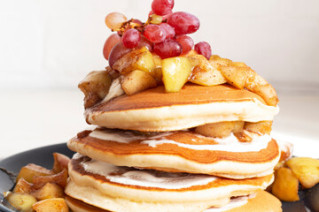 Pancakes with apple and grapes