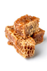 Honyecomb peaces macro isolated on white background.