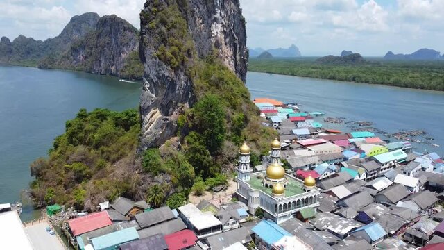 Drone video. flight over tropical islands in the Andaman Sea. muslim mosque on the island. Aerial view of village Ko Panyi island, Thailand.
