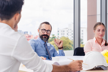 Fototapeta premium Group of business architecture or engineer in morning meeting startup