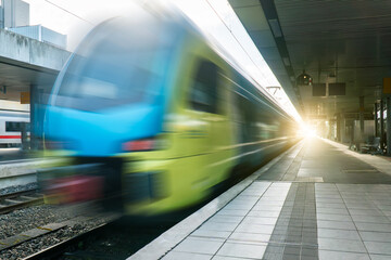 Fototapeta premium Abstract background travel of public transportation with blur speed motion movement of train on railway tunnel subway