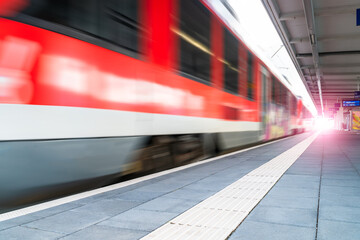 Fototapeta premium Abstract background travel of public transportation with blur speed motion movement of train on railway tunnel subway