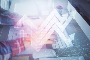 Growing arrows with businessman working on computer on background. Success concept. Double exposure.