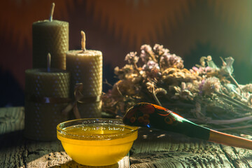 spa still life with candles, flowers and honey