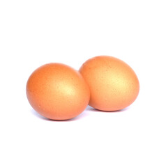 Two chicken eggs isolated on white background