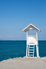 White lifeguard tower by the sea