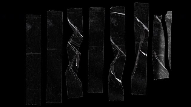 small light moving over set of transparent adhesive tape or strips isolated on black background with fingerprints and dust texture, crumpled plastic sticky snips, poster design overlays or elements.