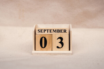 September 3rd. Image of September 3 wooden color calendar on white canvas background. empty space for text