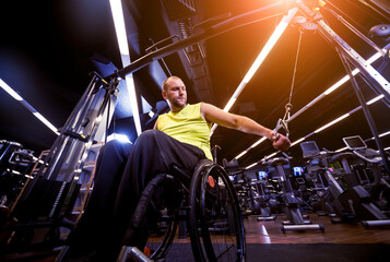 Disabled man training in the gym of rehabilitation center