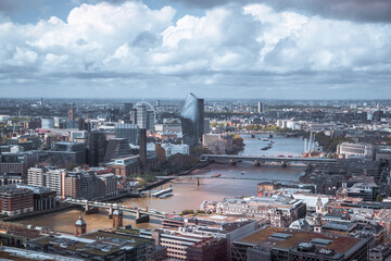 London, UK.  Thames river and London bridge. City of London view, business, banking and office area with lots of office buildings