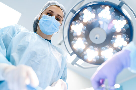 Female surgeon and assistant, professional surgery