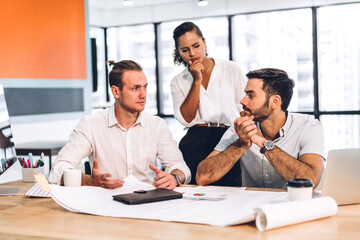 Fototapeta premium Group of professional business meeting and discussing strategy with new startup project.Creative business people planning and brainstorm with document report in modern workloft.Teamwork concept