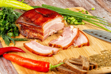 smoked meat lies on the table with herbs and sauce