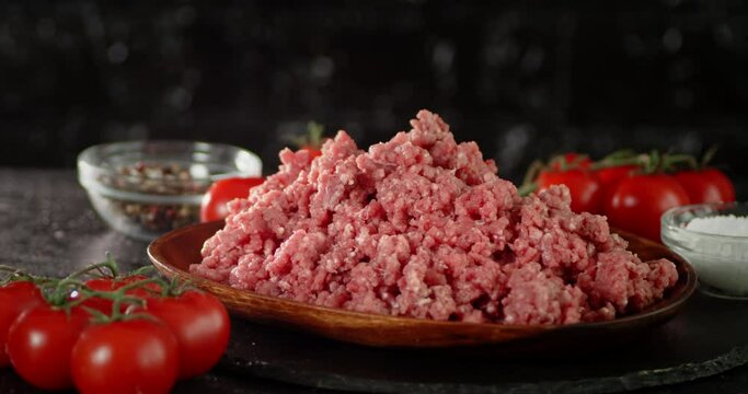 A full plate of raw minced meat rotates slowly. 