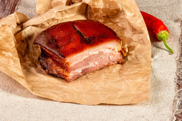 smoked meat wrapped in wrapping paper and tied with twine