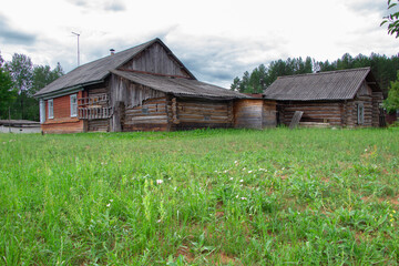 Photo of aged wooden house, back view