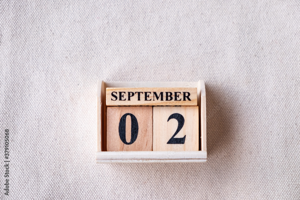 Fototapete september 2nd. image of september 2 wooden color calendar on white canvas background. empty space fo