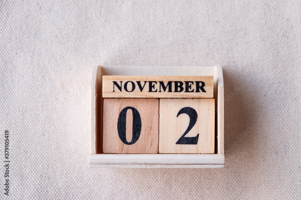 Fototapete november 2nd. image of november 2 wooden color calendar on white canvas background. empty space for 