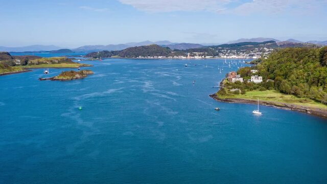 aerial view of the sound of kerrera and the island of kerrera near oban in the argyll region of the highlands of scotland during a clear blue calm day in autumn