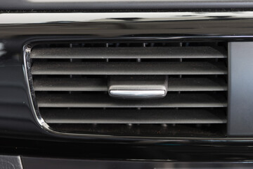 Fototapeta na wymiar Air conditioner vent grill in a modern car