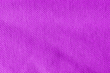 Fabric knitting wool texture purple color. Cloth knitted wool surface.