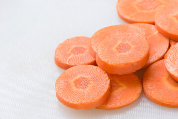 Pile of orange carrot slices, close up