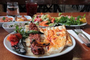 delicious Adana kebabs and salads on the plate