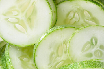 Pile of green cucomber slices, close up