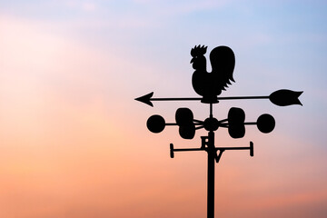 Chicken wind vane with compass and sky