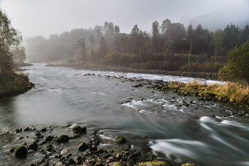 view of the mountain river in fog