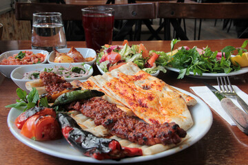 delicious Adana kebabs and salads on the plate