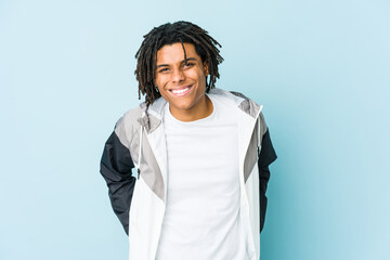 Young african american sport man happy, smiling and cheerful.