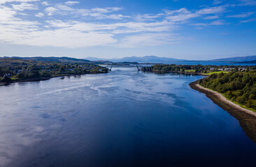 aerial view of the falls of lora near connel, connel bridge and oban in the argyll region of the highlands of scotland during a clear blue autumn day