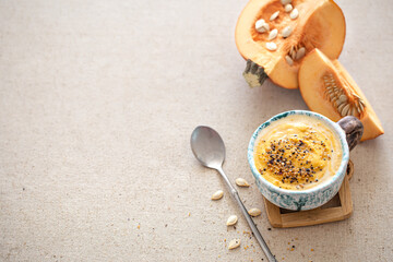 Delicious composition with pumpkin soup, top view.